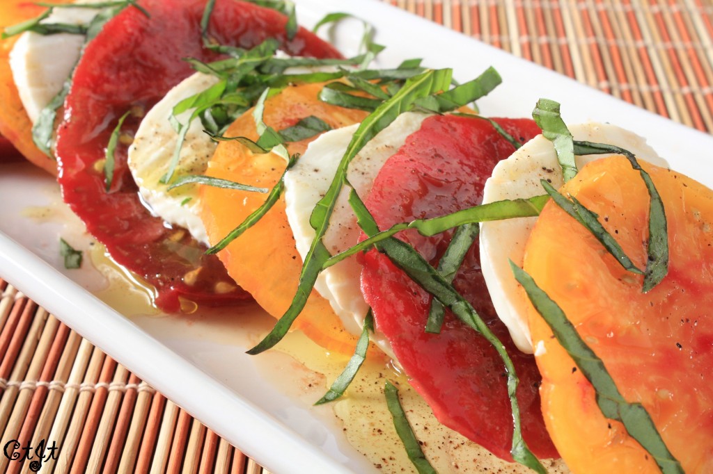 Caprese Salad with Heirloom Tomatoes Drizzled with a Summertime Peach White Balsamic & Meyer Lemon Olive Oil Vinaigrette featuring Sigona's Meyer Lemon Fusion Olive Oil and Sigona's Summertime Peach White Balsamic