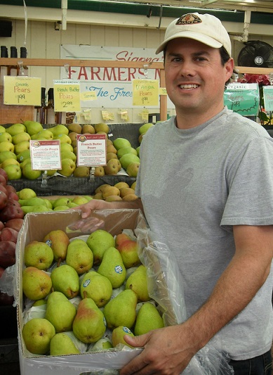 Robbie holding box of pears