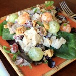 Chicken & Sweet Melon Salad with Grapes and Walnuts on a Bed of Mixed Greens