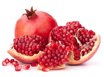 Ripe pomegranate fruit on white background