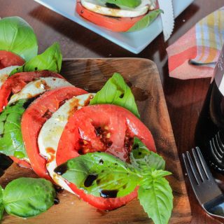 Traditional Caprese with heirloom tomatoes, olive oil and aged balsamic