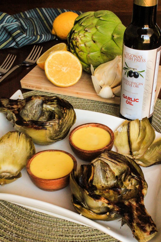 Grilled Artichokes with Garlic Aioli recipe featuring Sigona's Garlic Oil and Sigona's Meyer Lemon Fusion Olive Oil. Whole30. Paleo.