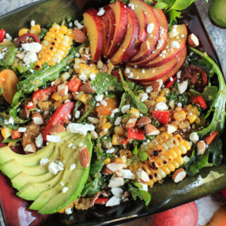 Fresh Peach Grilled Corn and Arugula Quinoa Bowl with a Peach and Baklouti Green Chili Vinaigrette featuring Sigona's Summertime Peach White Balsamic and Sigona's Spicy Baklouti Olive Oil a fantastic loaded salad buddah bowl