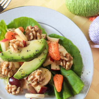 Fresh fruit salad with A Honey & Poppyseed Dressing on a Bibb Lettuce Bed