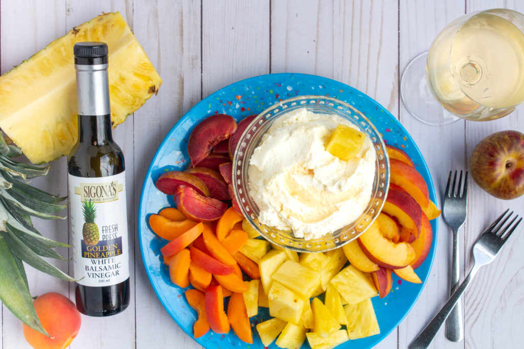 Pineapple balsamic whipped mascarpone & cream with fresh fruit for dipping, such as nectarines, pineapple, plums and peaches