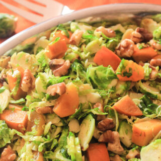 Shredded Brussels Sprouts with Fuyu Persimmons, Blenheim Apricots and Walnuts