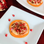 Fuyu persimmon rounds with pomegranates, honeyed mascarpone pecans